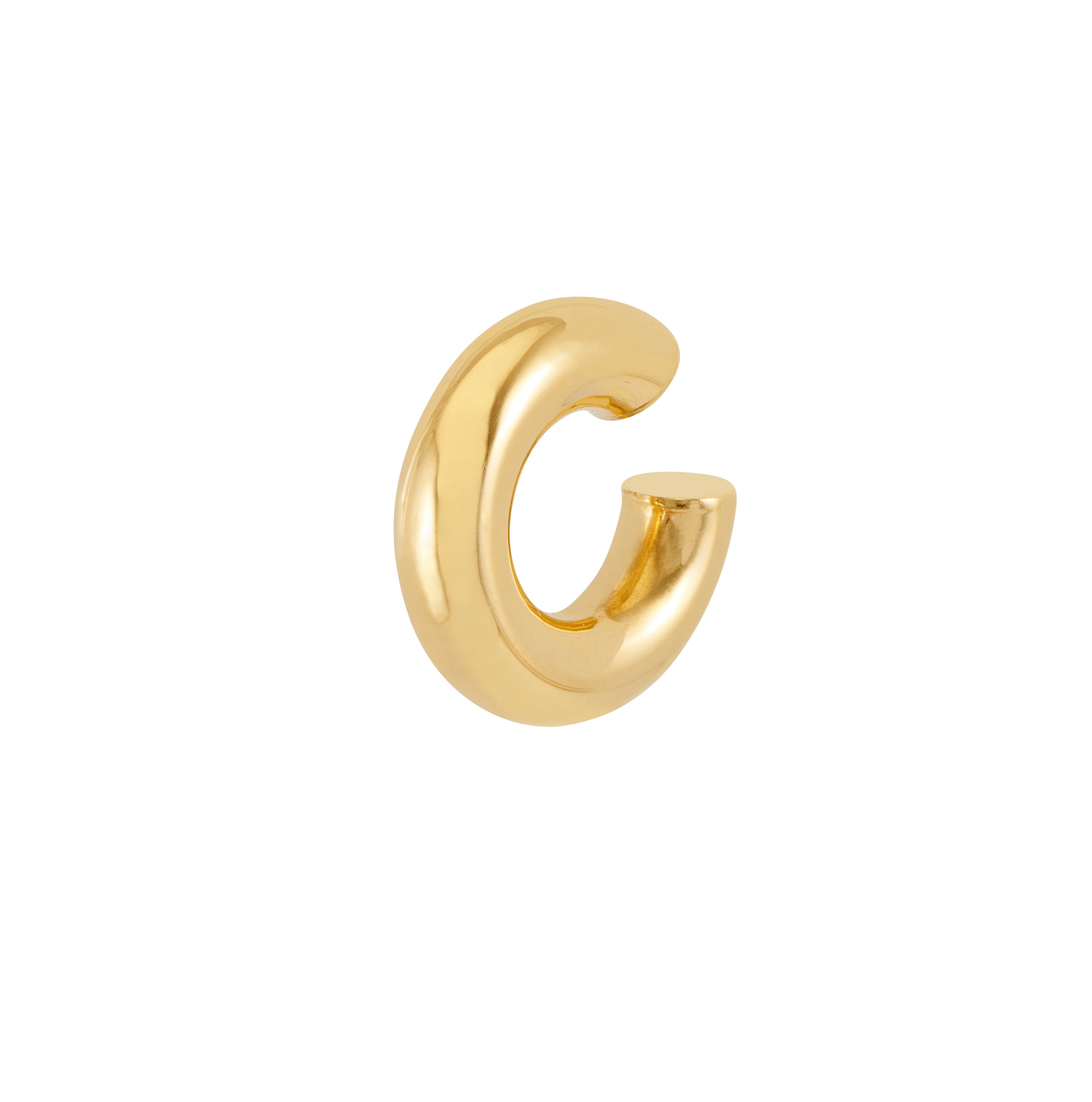 Gold hoop earring on a white background