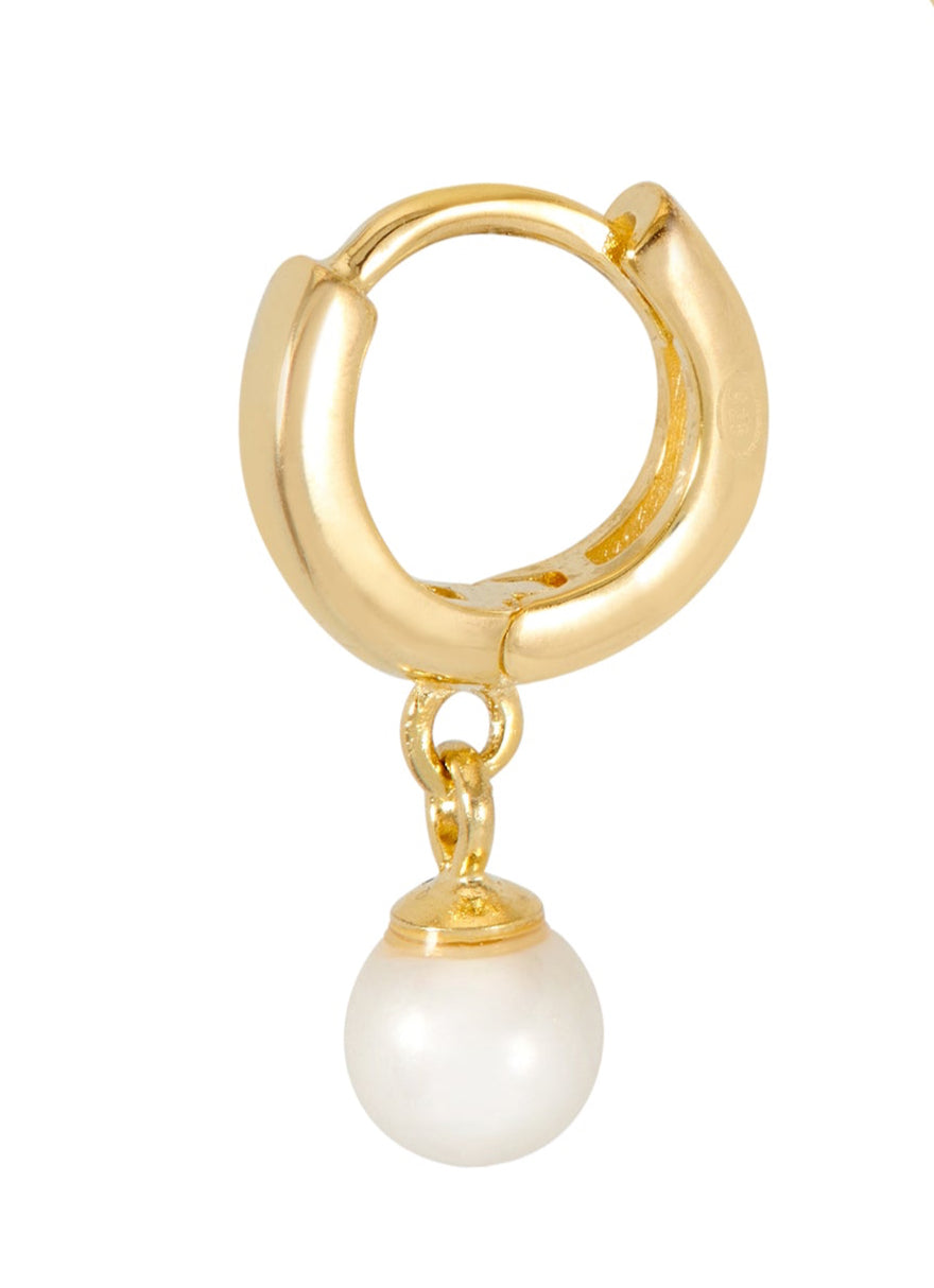 Gold hoop earring with a pearl charm on a white background