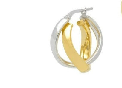 Gold and silver hoop earrings on a white background