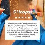 Person wearing gold hoop earrings with a product review overlay on a white background
