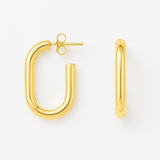 Gold hoop earrings on a white background