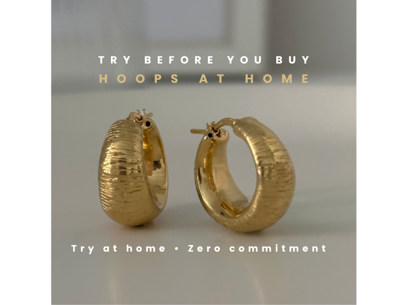 Gold hoop earrings on a light gray background with text about trying them before buying.