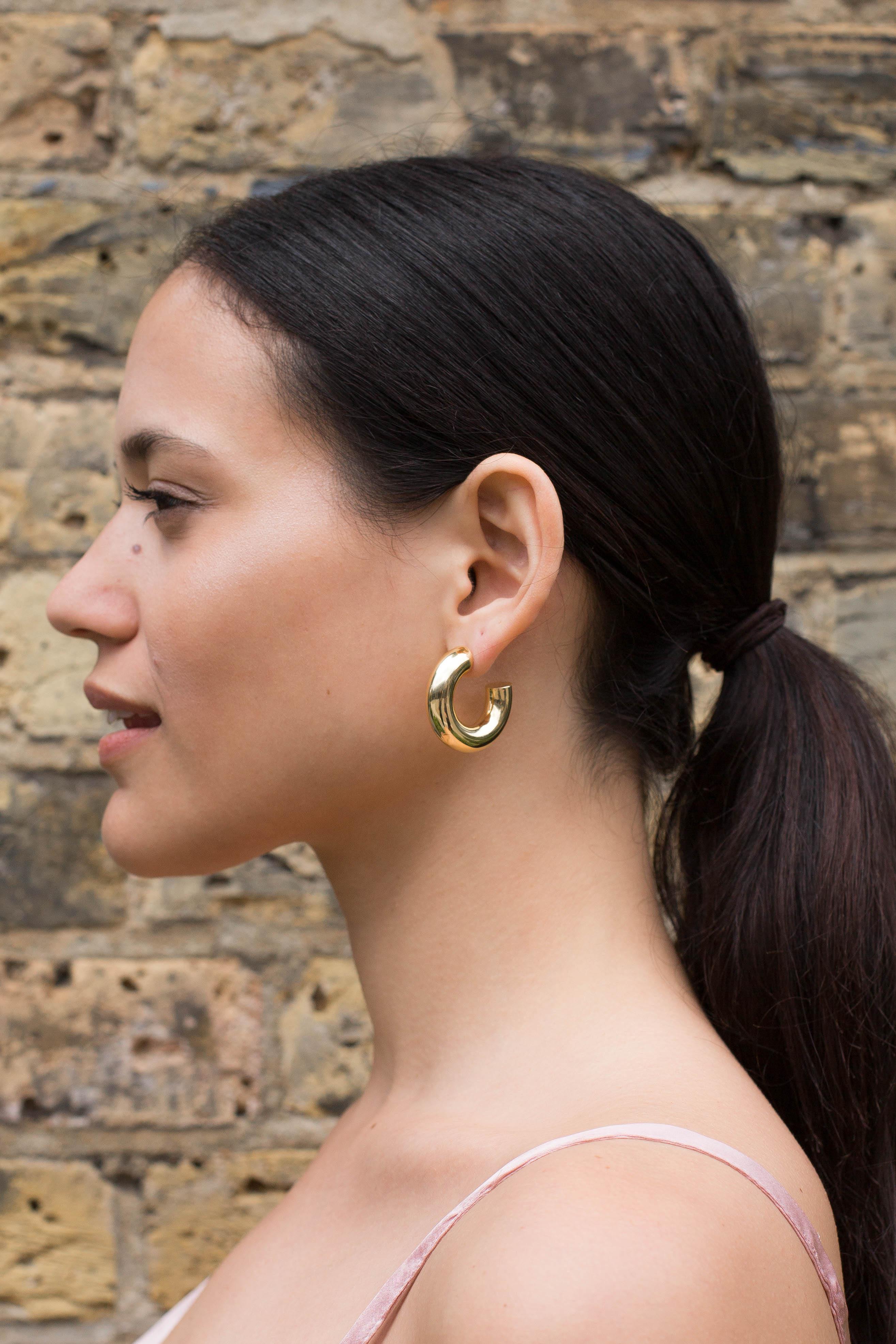 Large gold disk stud earrings