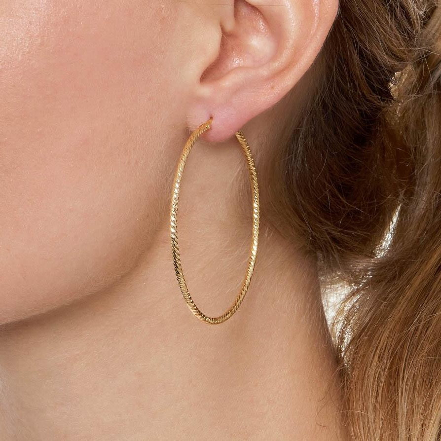 Sparkly diamond-cut gold hoop earrings